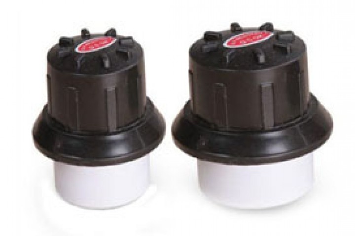 white and black color drip flush valve isolated on white background