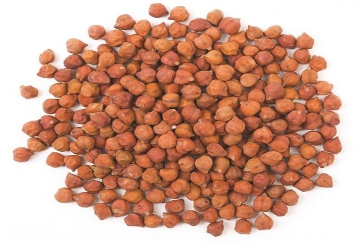 close up of pigeon pulses spilling from a jar