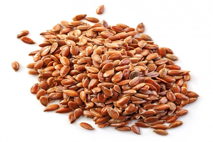 linseed heap of flax seeds isolated on white background
