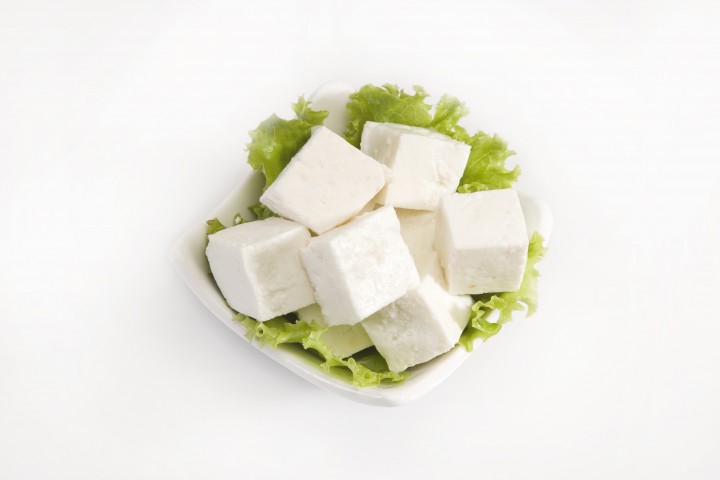 paneer piece of cheese or paneer isolated on a white background
